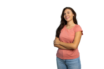 Cheerful young woman smiling, arms crossed, looking upward during studio photoshoot against transparent background