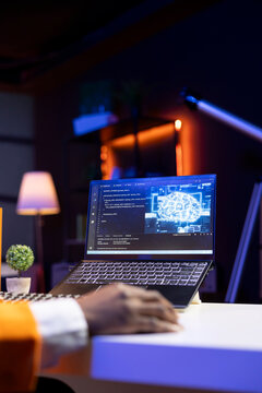 AI expert writes code on laptop in apartment office using Java programming languages. Artificial intelligence programmer remotely working on fixing database errors while working from home, close up