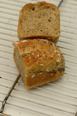 Perfectly baked artisan bread resting on a cooling rack with a beautiful crust and soft interior