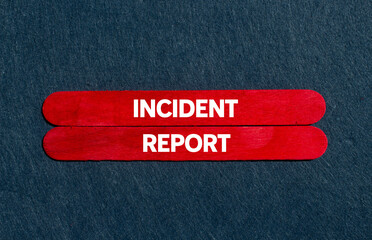 Incident report message written on red wooden sticks on gray background. Conceptual incident report...