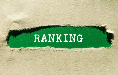 Ranking message written on ripped torn paper on green background. Conceptual ranking symbol. Copy...