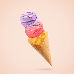 Yummy ice cream served in waffle cone in air on dark beige background