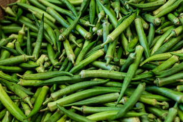 Green okra for sale at a market. Vegetable rich in fiber.