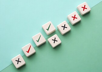 Obraz premium Alternating row of check and cross marks on white tiles against a two tone teal colored background