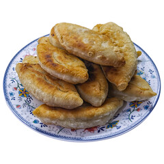 Fried meat pies on a plate isolate on white