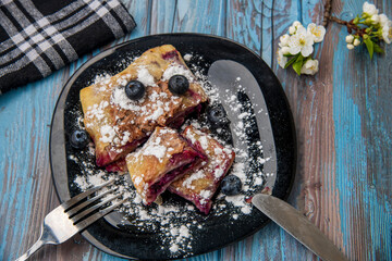 American blueberry pie, blueberry pie on a wooden table..