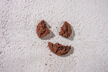A Close-Up Of Broken Chocolate Cookies, Highlighting Beauty Of Homemade Baked Goods On A Textured...