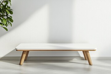 A white table with a wooden top sits in front of a wall