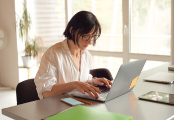 businesswoman working in office using laptop