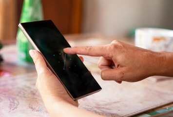 Hand unlocking smartphone with fingerprint