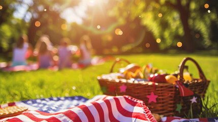 Memorial Day picnic scene with a basket of fruits and a blanket on the grass