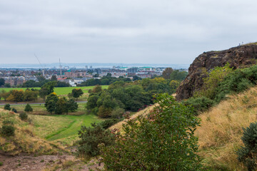 Beautiful view from Arthur's Seat to Edinburgh and the surrounding landscape. Hiking in Scotland.