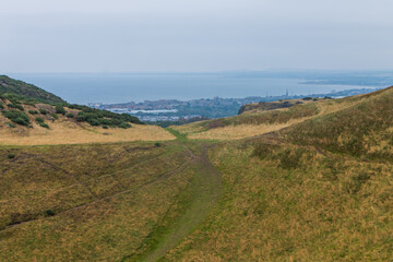 Beautiful view from Arthur's Seat to Edinburgh and the surrounding landscape. Hiking in Scotland.