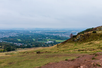 Beautiful view from Arthur's Seat to Edinburgh and the surrounding landscape. Hiking in Scotland.