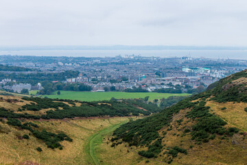 Beautiful view from Arthur's Seat to Edinburgh and the surrounding landscape. Hiking in Scotland.