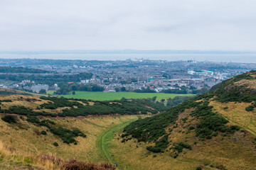 Beautiful view from Arthur's Seat to Edinburgh and the surrounding landscape. Hiking in Scotland.