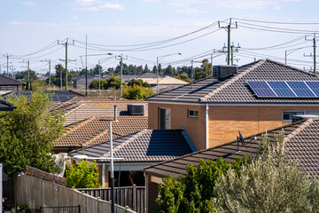 Residential rooftops in Williams Landing, Melbourne, showing modern brick homes with terracotta...