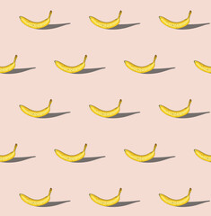 Seamless pattern of bananas on pastel background. Creative concept