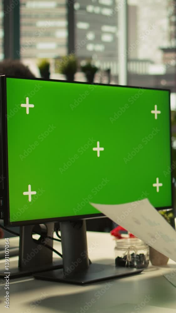 Poster vertical video employee at work using isolated screen pc display to finish project tasks. african am