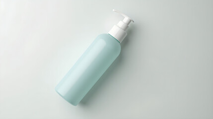 a travel-sized toiletry bottle, styled in in light concrete and cloud tones