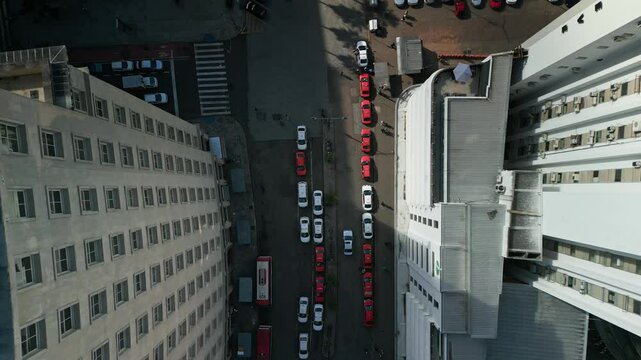 Flighting with drone between buildings on Borges de Medeiros street in Porto Alegre downtown, capital of the state of Rio Grande do Sul - Brazil
