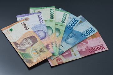 Assorted Indonesian Rupiah Banknotes on a Dark Background