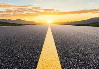 Fototapeta premium Asphalt Road Leading to Sunset Mountains