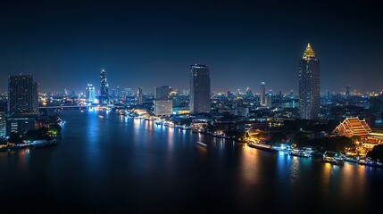 Obraz premium Illuminated cityscape reflects on a vast river during the nighttime hours