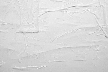 white crumpled and creased glued wrinkled paper poster texture background
