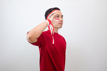 Giving Salute With Passion, Indonesian Youth Poses In Red And White To Celebrate Nationalist Independence Vibe.