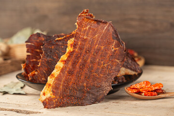 Dried beef crisps, beef crisps on a wooden background