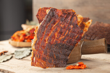 Dried beef crisps, beef crisps on a wooden background