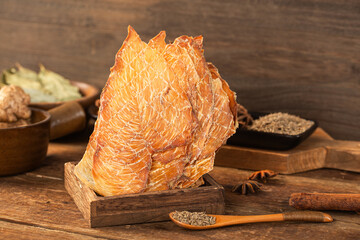 Brown dried chicken breast jerky meat texture close up