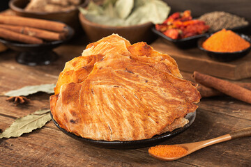 Brown dried chicken breast jerky meat texture close up