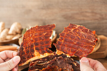 Dried beef crisps, beef crisps on a wooden background