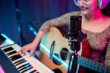 Professional Musician with condenser microphone and tablet for Mixing Mastering music. Music...