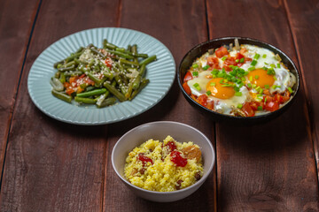 Jewish food tzimmes, chelnt, shakshuka and couscous with dried fruits for the holiday