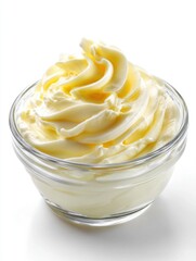 Creamy delight in a glass bowl a swirl of light yellow buttercream frosting on a bright white surface a culinary masterpiece for dessert enthusiasts