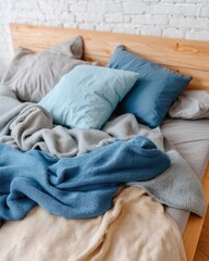 Obraz premium Cozy Bedroom Scene with Soft Blankets and Pillows on Wooden Bed Frame in Natural Light Setting
