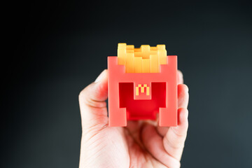 Fototapeta premium Bangkok, Thailand - April 8, 2025 : Fry Helmet Minecraft from McDonald, Toy form Minecraft blind box from McDonald's collaborates Minecraft the movice