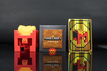 Fototapeta premium Bangkok, Thailand - April 8, 2025 : Fry Helmet Minecraft from McDonald, Toy form Minecraft blind box from McDonald's collaborates Minecraft the movice