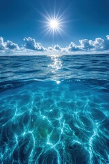 Tranquil turquoise ocean water under a bright sun and fluffy clouds creating a serene and peaceful atmosphere perfect for travel and relaxation