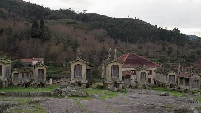 Traditional stone granaries of Lindoso in Alto Minho Portugal with forest backdrop