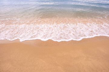 Nature of the beach and sea Summer with sunshine, sandy beaches, clear blue waters sparkling against the blue sky. On an island with good ecology and environment Background for summer vacation