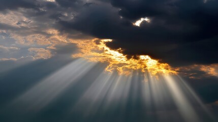 Dramatic Sky with Golden Sunlight Rays Breaking Through Dark Storm Clouds Creating a Hopeful and Ethereal Atmosphere