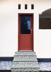 Aesthetic combination of basic architectural elements, door, vent, and stairs. Showcasing simplicity and comfort in a visually pleasing arrangement