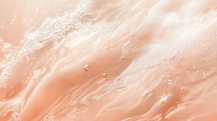 Soft, flowing water with bubbles in a peachy hue, creating a calming visual effect.