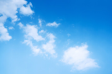 The sky is a vibrant, cloudless blue, while the sun shines brightly, making it appear even more radiant.