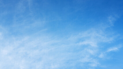 The sky is a vibrant, cloudless blue, while the sun shines brightly, making it appear even more radiant.