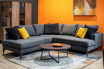 Gray sectional sofa with orange wall
